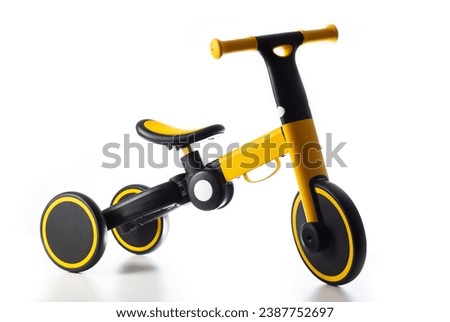 Children's balance bike on a white background, isolate. Children's tricycle.