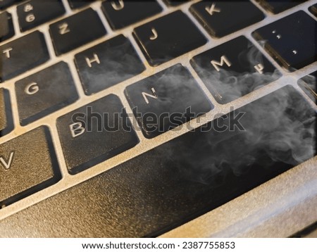 Smoke around a keypad of a PC
