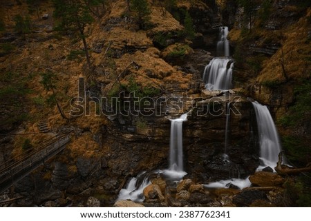 Wonderful Great Cascade in Autumn Time, A Great Waterfall in The Mountains, The Kuhflucht Waterfalls in The Bavarian Alps, Long Exposure Photography , 