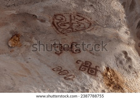 Petroglyphs on ceiling of Fontein cave, Aruba. Drawn by Arawak indians, approximately 2500-3000 years ago. 
 Royalty-Free Stock Photo #2387788755