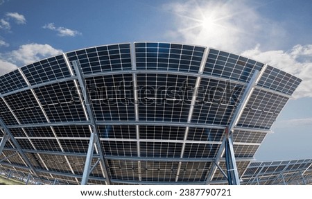 Photo collage of bilateral solar panels, photovoltaics, with natural sun flare - alternative source of electricity, concept of sustainable and renewable resources. Panoramic backwards view.