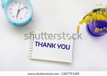 On a white background, a notepad with the word THANK YOU. retro style image