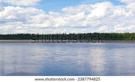 wide northern blue calm beautiful Pechora river in Komi Republic in summer