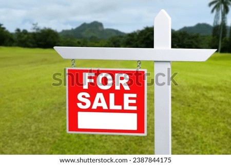 FOR SALE SIGN on empty meadow - Real estate conceptual image