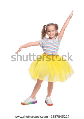 Cute little girl in tutu skirt dancing on white background Royalty-Free Stock Photo #2387845227