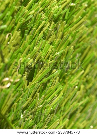 industrial style Detail of green grass artificial lawn meadow, useful as a background