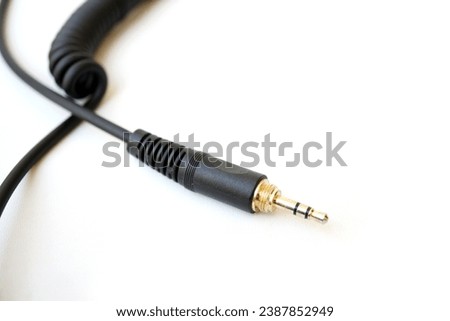 spiral headphone audio jack cable with empty space isolated on white background Royalty-Free Stock Photo #2387852949