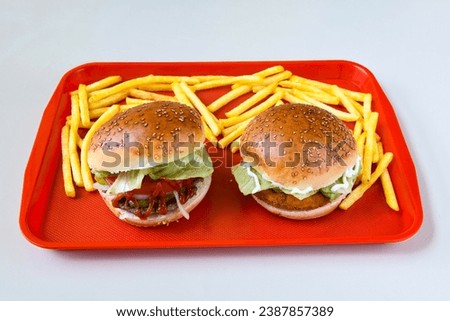 Big tasty burger with beef cutlet on a plate. Hamburger, cheeseburger with mushroom. Crispy chicken burger.