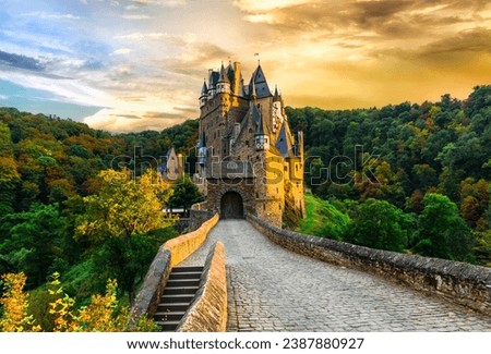 wonderful romantic Medieval castles  of Germany in autumn colours over sunset Burg Eltz, one of the most beautiful in Europe Royalty-Free Stock Photo #2387880927