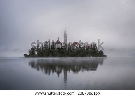 The famous Alpine Lake Bled (Blejsko jezero) in Slovenia, an amazing autumn landscape. Fabulous view of the lake, island with church, Bled Castle,