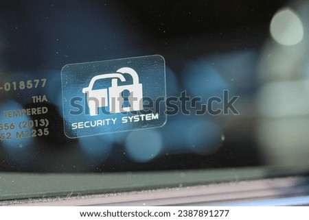 Security System sticker on a new car window