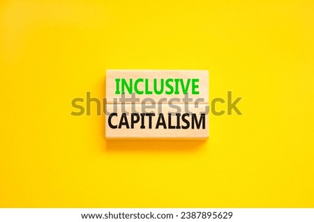 Inclusive capitalism symbol. Concept words Inclusive capitalism on beautiful wooden blocks. Beautiful yellow table yellow background. Business inclusive capitalism concept. Copy space.