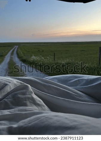 Sunset on a beautiful night with covers in car