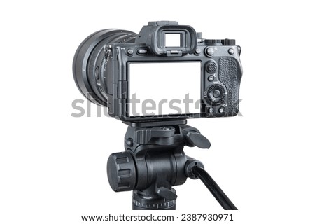 Photo camera. Digital or Dslr camera on tripod. Photographer or videographer studio for recording film project. Professional blogger, television equipment. Camera, display, lens. Isolated background