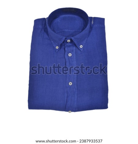 Folded button-down linen shirt of the cobalt color on white background. Photography for a clothing store website. Photo for social networks of a clothing store.