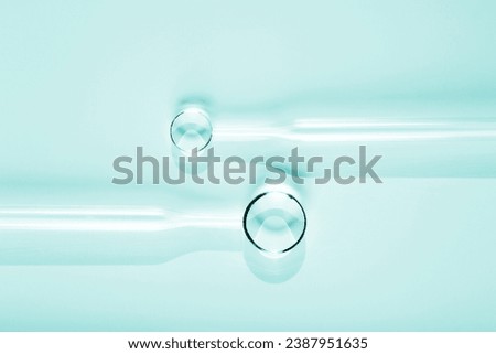Chemical laboratory research. Abstract cosmetic laboratory. Glass models of molecules with pipettes. Flat lay. Copy space.