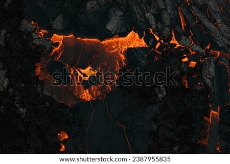 Aerial view of the texture of a solidifying lava field, close-up Royalty-Free Stock Photo #2387955835