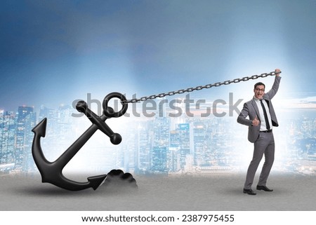 Businessman with anchor in business concept Royalty-Free Stock Photo #2387975455