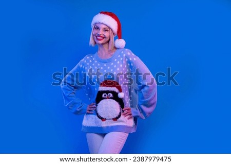 Photo of gorgeous positive girl toothy smile put hands waist enjoy newyear event isolated on neon blue color background