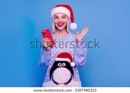 Photo of cheerful positive girl wear trendy clothes rejoice winter holidays advent isolated on blue color neon light background