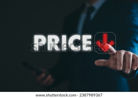Low price concept. Businessman thouching arrow down, low price stimulate the economy and maeket. decline price Royalty-Free Stock Photo #2387989367