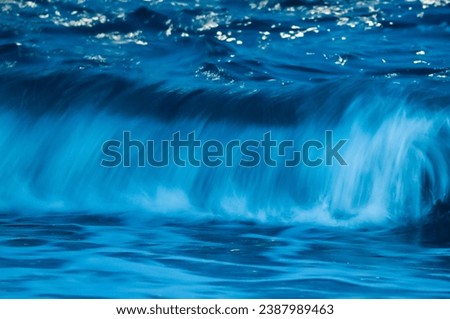 Waves with strong wind after a storm, abstract texture, Patagonia, Argentina.