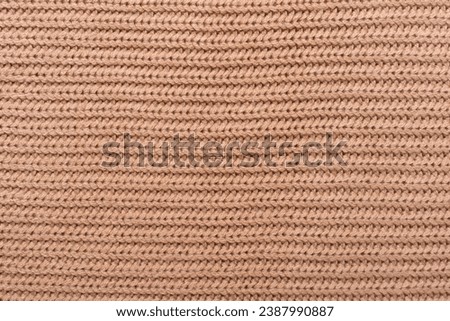 Texture of knitted wool textile material as background