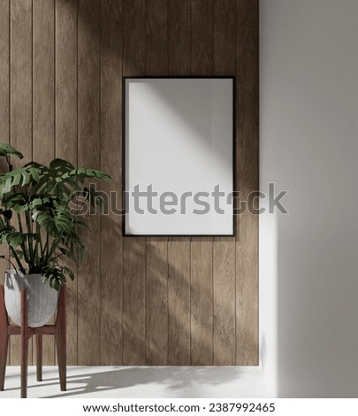 wooden frame mockup poster hanging on the wooden panel wall with plant decoration. 70x100 frame mockup poster