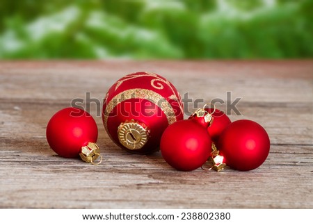 red christmas balls on wood