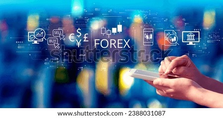 Forex trading concept with person using a smartphone in a city at night Royalty-Free Stock Photo #2388031087