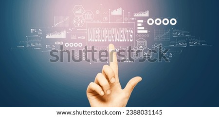 Micropayments theme with hand pressing a button on a technology screen Royalty-Free Stock Photo #2388031145