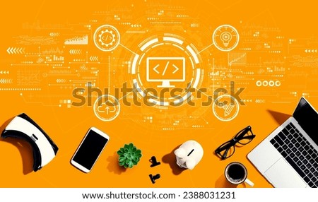 Web development concept with electronic gadgets and office supplies - flat lay