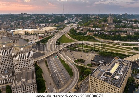 Cincinnati, Ohio transportation infrastructure. View from above of American big freeway intersection at sunset with fast moving cars