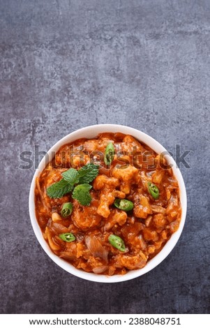 Cauliflower Gobi manchurian curry  chilli chicken red hot and spicy curry Mumbai Delhi India. Popular North Indian side dish for chapati  roti naan paratha  fried rice  pulao. Indo Chinese cuisine. Royalty-Free Stock Photo #2388048751