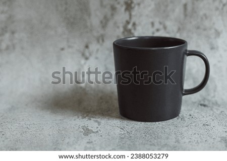 Black coffee mug on grey background. Template, layout for your design, advertising, logo with copy space.