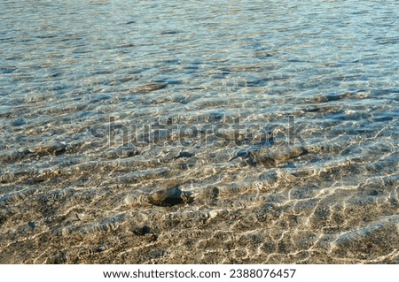 Shimmering Lake Water shot on 35mm film Royalty-Free Stock Photo #2388076457