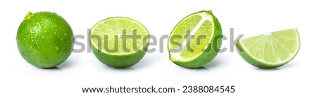 Set of whole and half slice of green lime fruit isolated on white background. Royalty-Free Stock Photo #2388084545