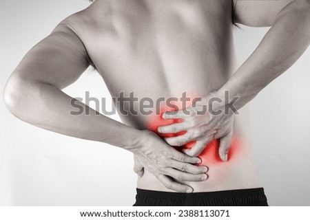 man's hand he is caught at the waist and her back is painful at the back in the room. health concept Royalty-Free Stock Photo #2388113071