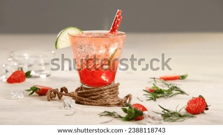 Tropical berry fruity menu soda fizzy drinks. Glass of strawberry fruit soda juice on styling decoration background for poster menu recipes