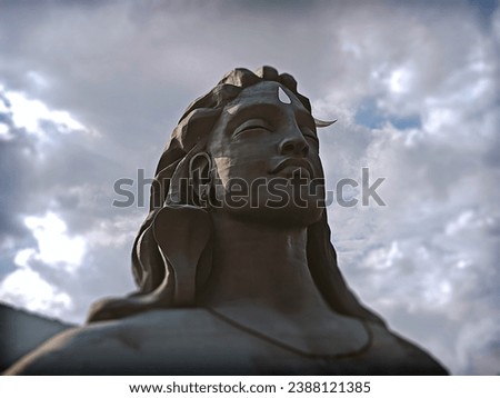 Lord Shiva statue architecture, with a snake depicting awareness and crescent moon signifying a calm composure and cool demeanor. Royalty-Free Stock Photo #2388121385