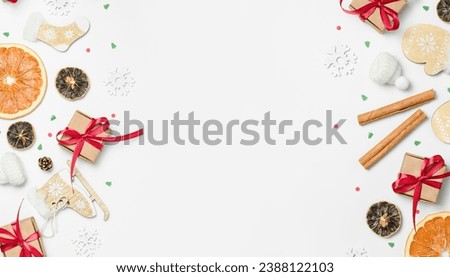 background with various Christmas and winter decorations on the edges and copy space in the center