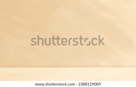 Empty cream beige room studio with shadow of leaves for product presentation. Autumn background.  Summer tropical backdrop. Cosmetic showroom. 