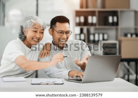 Businessman using laptop computer in office. Happy people, entrepreneur, small business owner working online.
