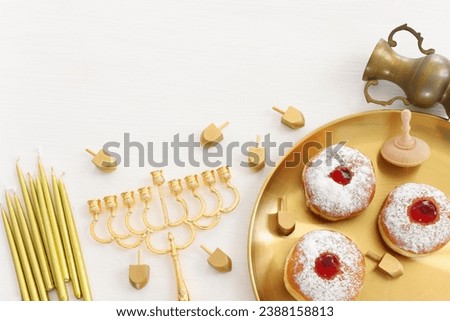 Religion image of jewish holiday Hanukkah background with menorah (traditional candelabra) and candles. top view