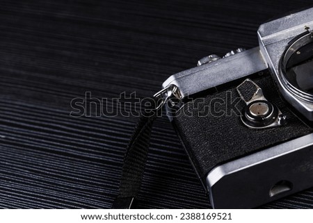 Old film camera, dark gray background