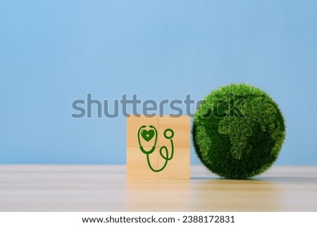 World Health Day 2024 Concept.Globe with a stethoscope icon on wooden block.World environment day.ESG and CSR. SDG sustainable development goals. Royalty-Free Stock Photo #2388172831