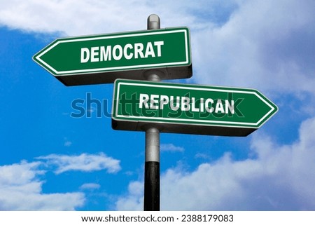 Two direction signs, one pointing left (Democrat), and the other one, pointing right (Republican). Royalty-Free Stock Photo #2388179083