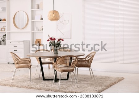 Stylish dining room interior with table and chairs. Space for text
