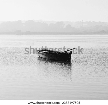 boat on a quiet black and white lake