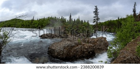 Lake Clark National Park in Alaska. Tanalian Falls and river. Spruce trees, rugged mountains and popular day hike area near Port Alsworth. Royalty-Free Stock Photo #2388200839